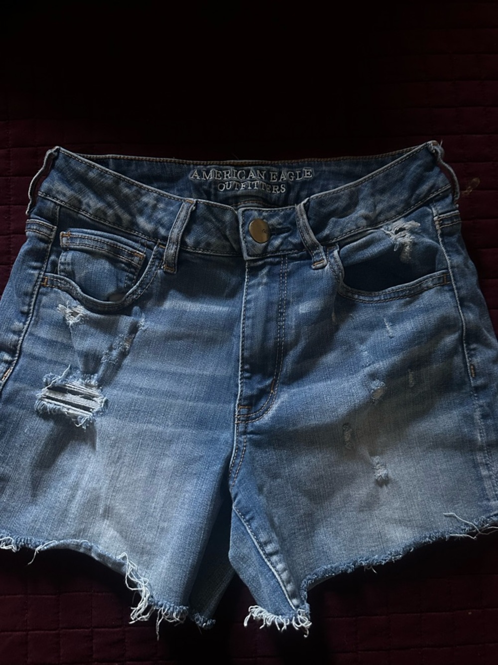 American Eagle Outfitters light blue distressed denim shorts